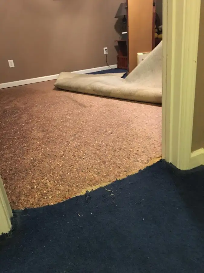 Carpet pad removal revealing water damage during Water Mitigation Services in Yreka